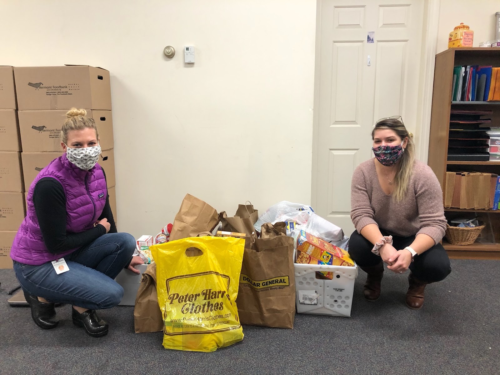 Velco workers with masks on preparing to distribute halloween treats