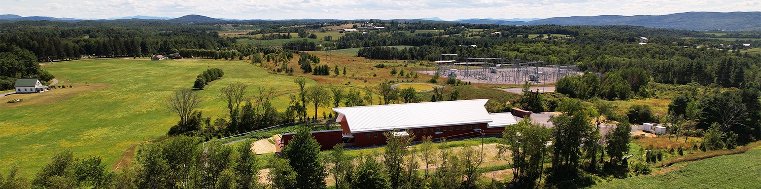 Arial view of a farm near a power station