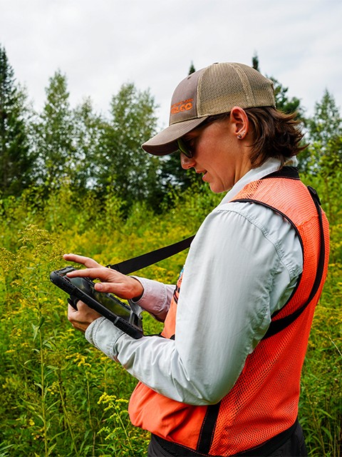 Field worker entering data on a device