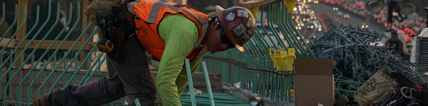 Person working on metal grating